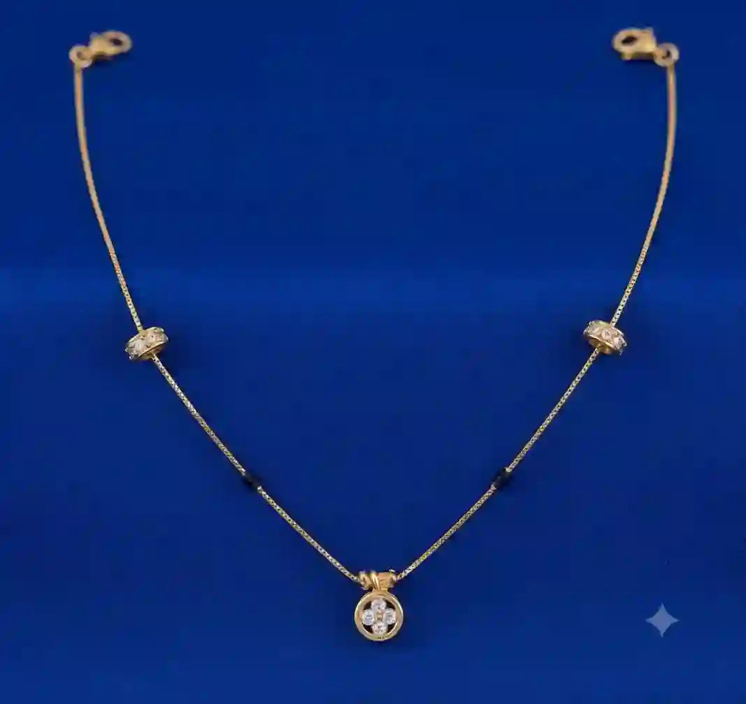 Gold diamond accent necklace with floral pendant on blue background